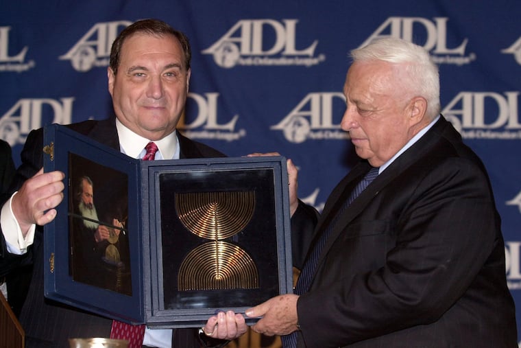Abraham Foxman (left) presents the ADL's Distinguished Statesman Award to Israeli Prime Minister Ariel Sharon in 2002.