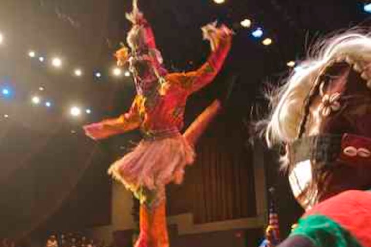 To celebrate Campbell's funding groups for another summer, Pasha the Stiltwalker performs with the Universal African Dance and Drum Ensemble at Gordon Theater in Camden.