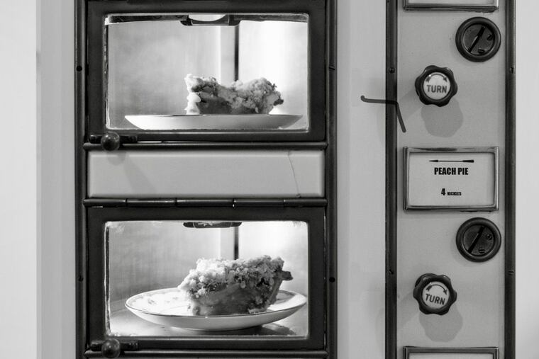 The Automat at Horn & Hardart was a series of windows filled from the rear with food. Customers fed coins into the slots.