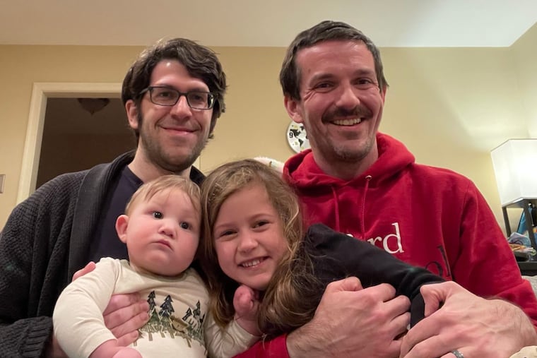 Stephen (left) and Adam with children EJ and Edie.