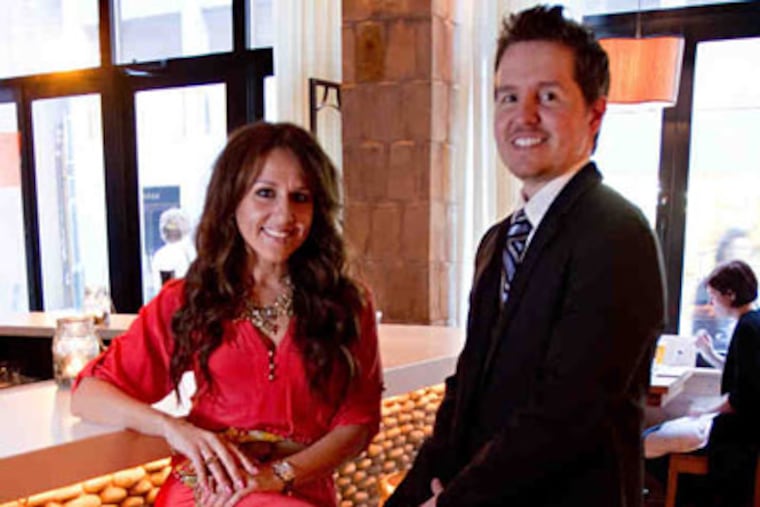 Opa owners Vasiliki Tsiouris and George Tsiouris,sister and brother, at the bar.
