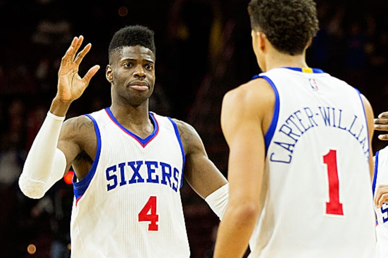 76ers center Nerlens Noel and guard Michael Carter-Williams. (Bill Streicher/USA Today Sports)