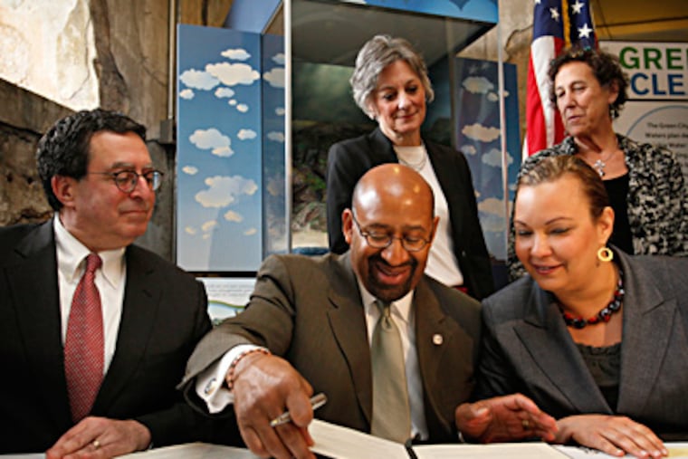 Howard Neukrug (clockwise from left), city water commissioner; U.S. Rep. Allyson Y. Schwartz; Rina Cutler, deputy mayor for transportation; Lisa Jackson, EPA administrator; and Mayor Nutter join in the official approval of "Green City, Clean Waters." MICHAEL S. WIRTZ / Staff Photographer