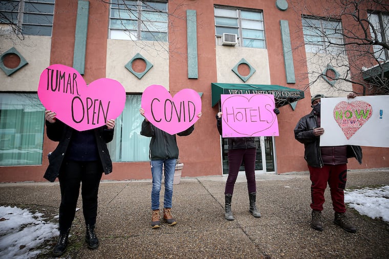Demonstrators protest outside the home of Tumar Alexander, managing director of Philadelphia, Sunday to demand the reopening of COVID-19 hotels for the city's homeless.