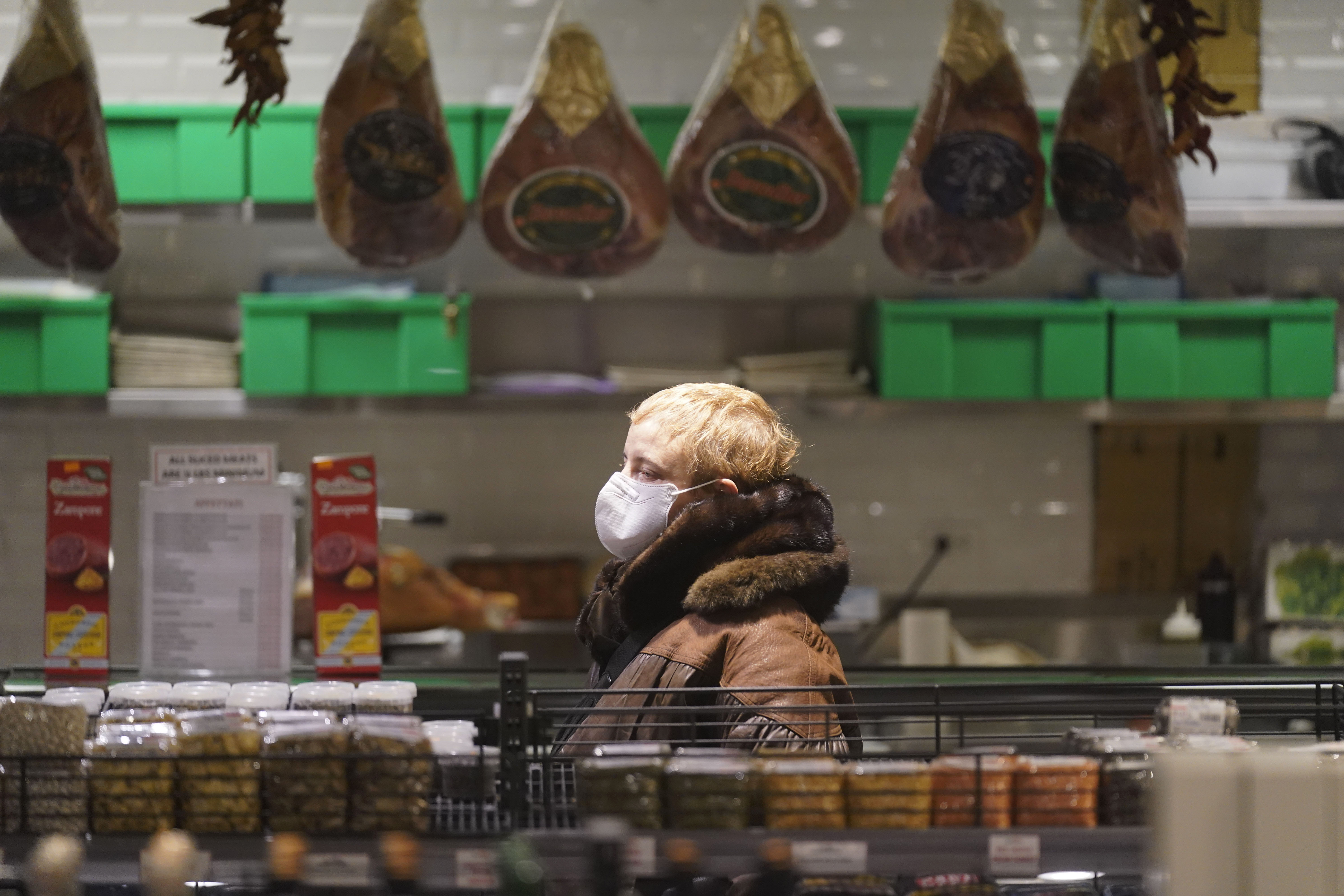 A shopper wears a mask in a market in New York earlier this month.