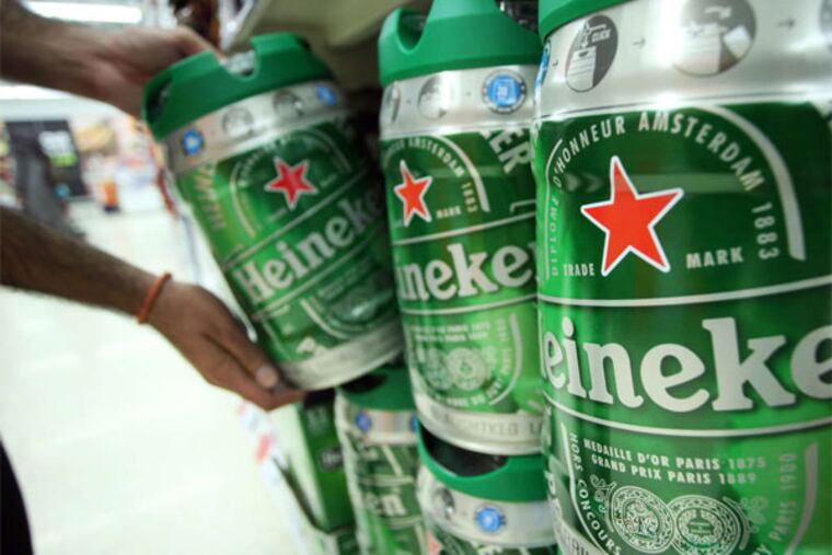 Crown's products include keg-shaped Heineken beer cans. The company's acquisition of Mivisa Envases SAU will strenghten its presence in Spain, chief executive officer John W. Conway said. (Chris Ratcliff / Bloomberg)