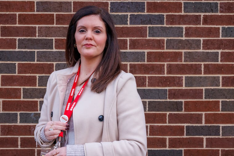 Tiffany Murphy, a licensed professional counselor and therapist with Rogers Behavioral Health, holds her National Union of Healthcare Workers button.