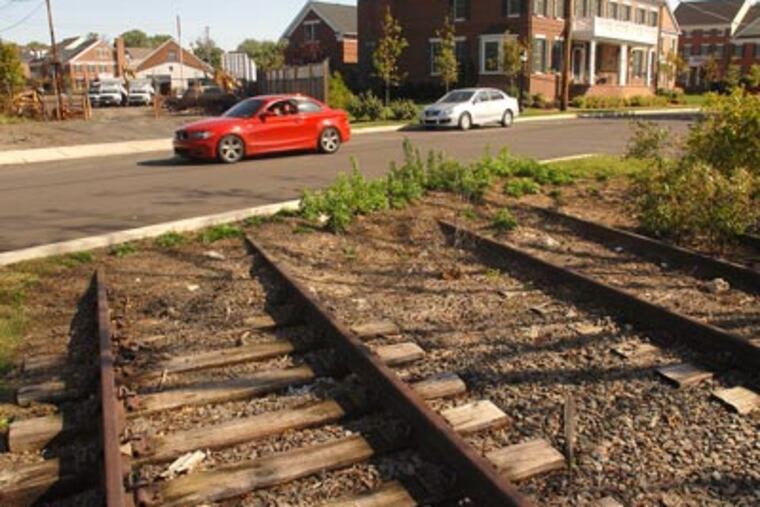 The rails stop when they reach Penn Street in Newtown. (Tom Gralish / Staff Photographer )
