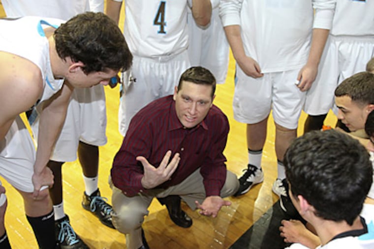 Westtown head basketball coach Seth Berger talks to his team during a timeout. (Steven M. Falk/Staff Photographer)