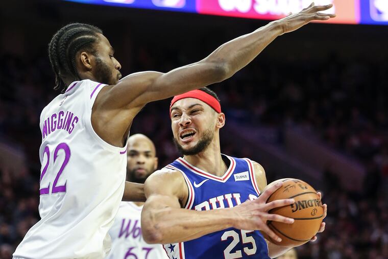 Sixers' Ben Simmons drives on Timberwolves' Andrew Wiggins during the 2nd quarter at the Wells Fargo Center in Philadelphia, Tuesday, January 15, 2019. STEVEN M. FALK / Staff Photographer