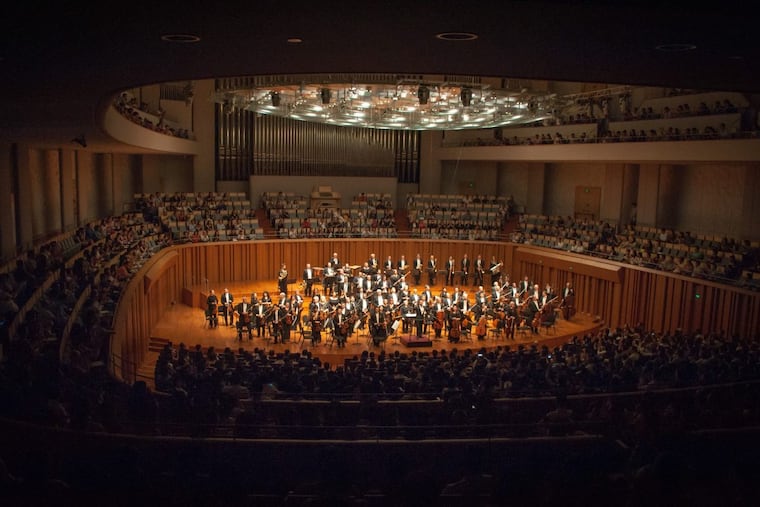 Yannick Nézet-Séguin and The Philadelphia Orchestra acknowledge the applause of the audience after a concert at Beijing’s National Centre for the Performing Arts during the 2016 Tour of Asia. .
