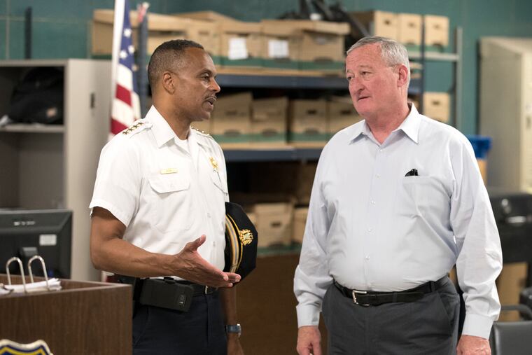 Philadelphia Police Commissioner Richard Ross, Jr., left, and Mayor Kenney speak before a tour at the 12th District Police Station on June 22, following a bloody weekend in the City and a few weeks after an explosive report on officers' social media posts.
