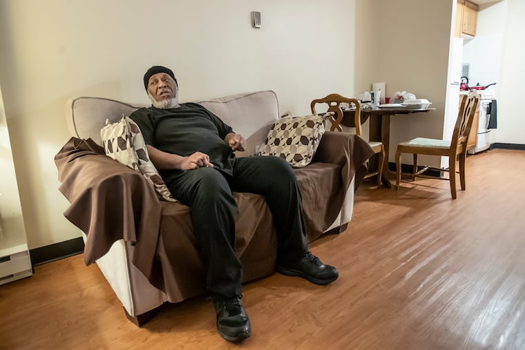 Purvis Wright, 62, relaxes on the couch after he returns to his apartment on the second floor at New Courtland Square residences on the grounds of Germantown Home.