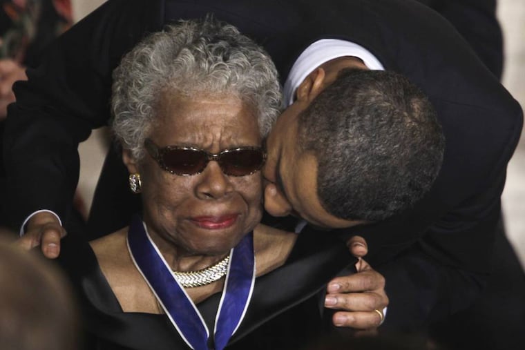 FILE - In this Feb. 15, 2011 file photo, President Barack Obama kisses author and poet Maya Angelou after awarding her the 2010 Medal of Freedom during a ceremony in the East Room of the White House in Washington. Angelou, author of "I Know Why the Caged Bird Sings," has died, Wake Forest University said Wednesday, May 28, 2014. She was 86. (AP Photo/Charles Dharapak, File)