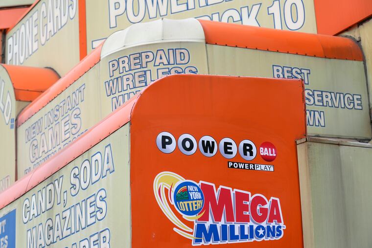 The awnings of a store advertise the sale of lottery tickets, including Mega Millions in January in New York.