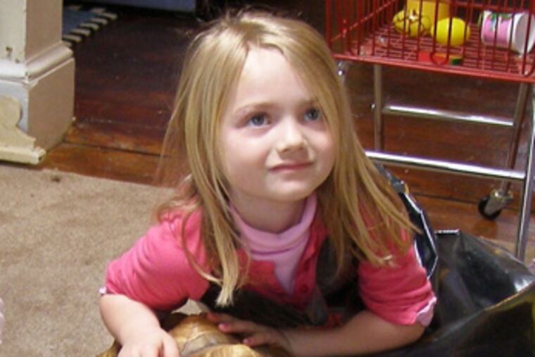 Nala, the tortoise that got away, with Meghan Moyer, 4-year-old neice of Nala's owner, Simmer Dougherty.