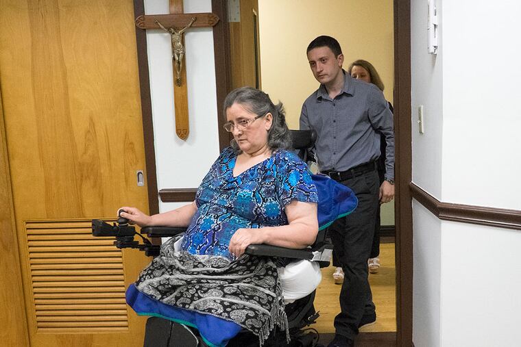Mariya Plekan and son Andrew in June at the nursing home where she was recuperating. (ED HILLE/File Photograph)