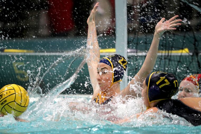La Salle’s Kalista Hyham (center) defends against Marist in a water polo match at La Salle University.