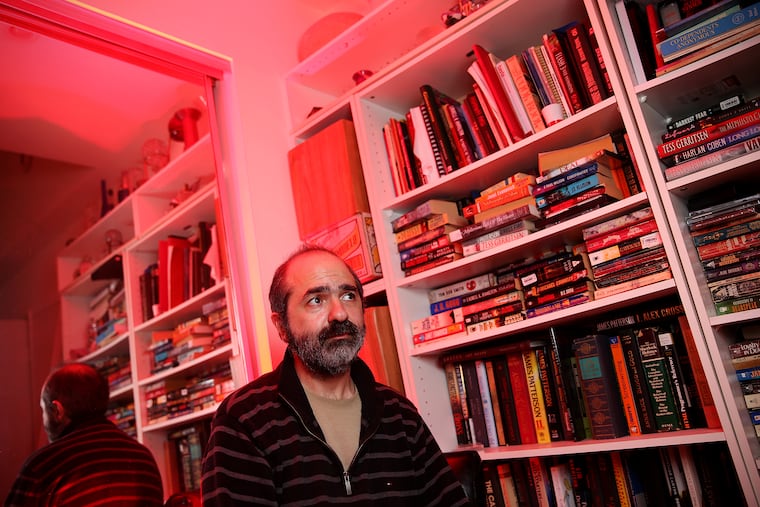 Filmmaker David Boorboor sits for a portrait inside his home in Marlton, N.J., on Tuesday, July 2, 2019. Boorboor has been dealing with complex regional pain syndrome for the last three years.