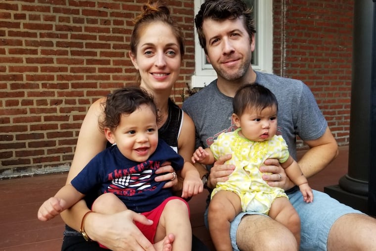 Anne Daly (holding Vaughn) and Pete Daly (holding Camille).