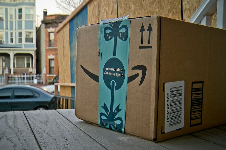 This image taken from video shows an Amazon package containing a GPS tracker on the porch of a Jersey City, N.J., residence after its delivery in 2018. The explosion in online shopping has led to porch pirates and stoop surfers swiping holiday packages from unsuspecting residents.