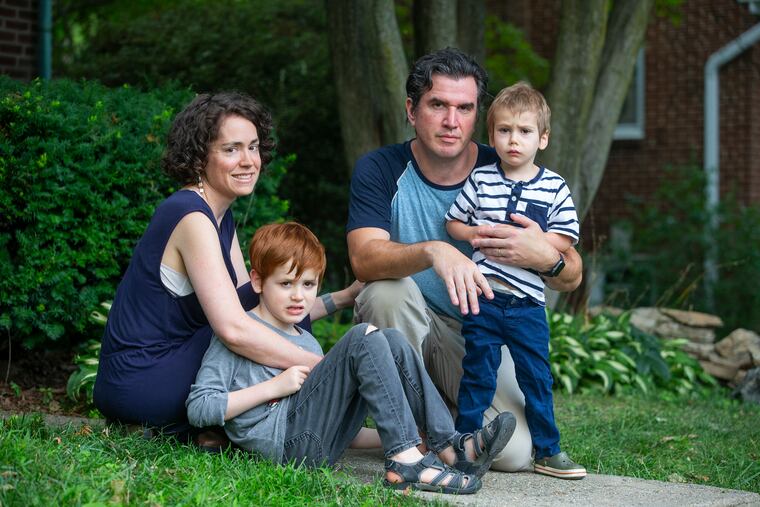Mark Fasano, pictured outside his home with wife Becca Block and sons Ryan, 7, and Jack, 2, is among the Lower Merion parents who think the district could be offering some in-person learning safely.