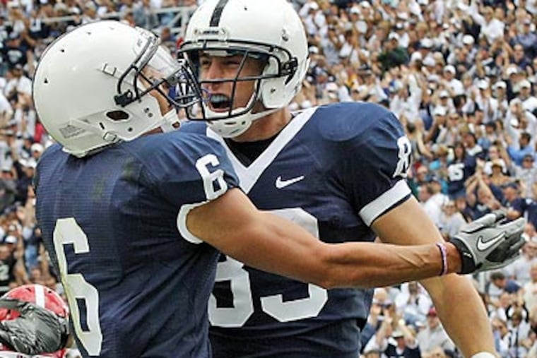 Penn State receiver Brett Beckett, right, celebrates with Derek Moye (6) after scoring in the second quarter. (AP Photo/Gene J. Puskar)