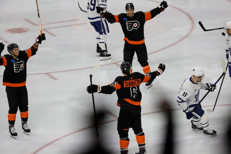 Travis Sanheim celebrates his goal as the Flyers hold off the Maple Leafs, 4-3, on Tuesday/
