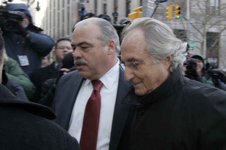 Bernard Madoff, right, arrives at Federal Court for a scheduled hearing Wednesday, Jan. 14, 2009 in New York. (AP Photo/Frank Franklin II)