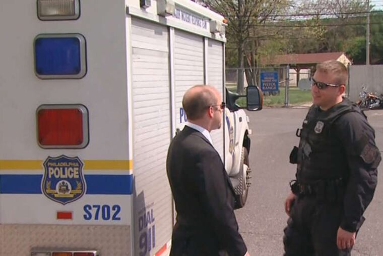 CBS PHILLY PHOTO FBI Agent Brian Hoffman (left) and Philadelphia Police Officer Matthew Fleming talk about their rescue of runner on the course.