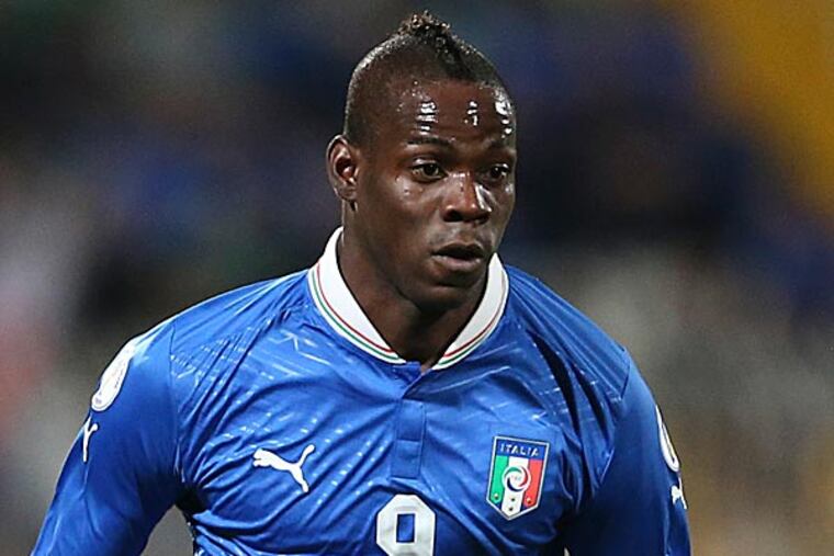 Mario Balotelli, the gifted-yet-troubled soccer star for AC Milan, has a penchant for doing stupid things. (Antonio Calanni/AP)