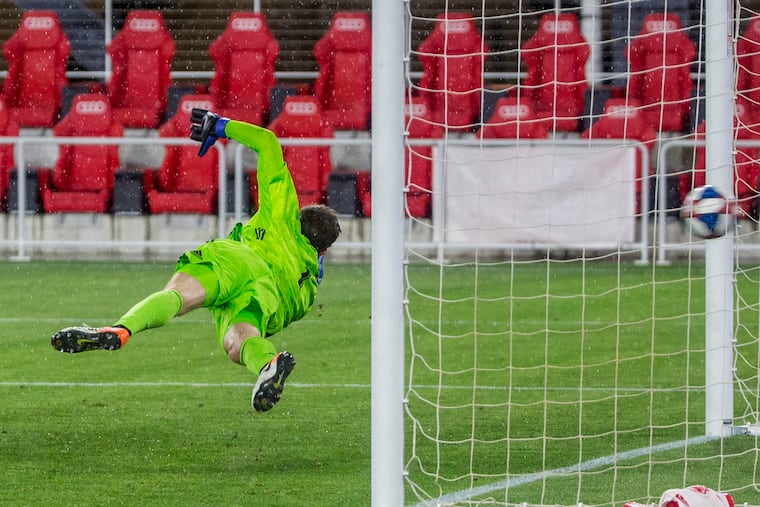 Union goalkeeper Matt Freese couldn't stop Wayne Rooney's smashed penalty kick that won the game for D.C. United in extra time.