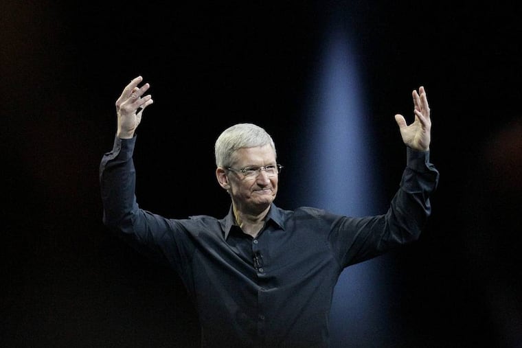 FILE - In this June 2, 2014 file photo, Apple CEO Tim Cook gestures during the Apple Worldwide Developers Conference in San Francisco. Apple's stock touched a new high Wednesday, Aug. 20, 2014, reflecting investors' renewed faith in Cook's ability to outwit the competition and expand the technological hit factory built by the late Steve Jobs. (AP Photo/Jeff Chiu, File)