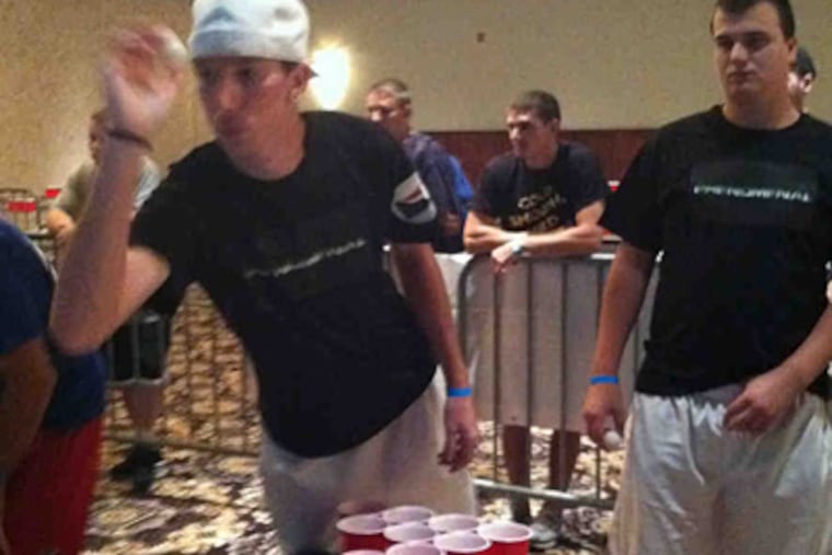 Rob "Ace" Schultz of Wilkes-Barre lines up a shot while teammate Alex Kowalczyk watches.