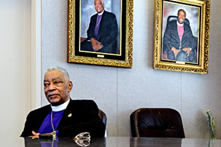 Bishop Richard Franklin Norris of the First Episcopal District of the African Methodist Episcopal Church reflects upon his tenure, in a conference room at administrative offices in Philadelphia, surrounded by portraits of his predecessors. TOM GRALISH / Staff Photographer