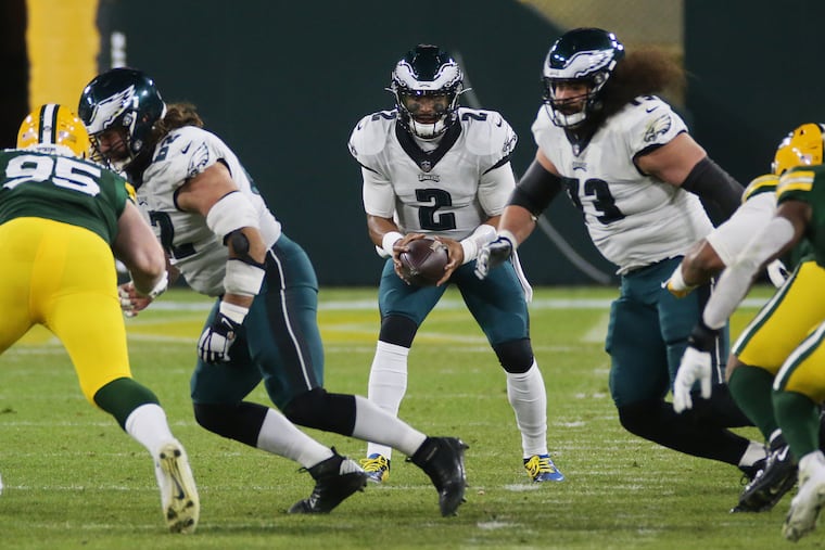 Jalen Hurts was 5 for 12 with a touchdown and an interception in relief of Carson Wentz on Sunday at Green Bay.