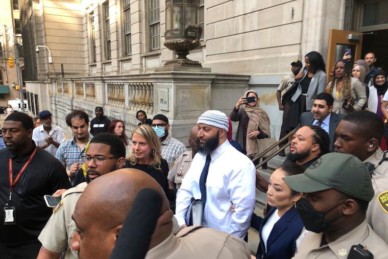 Adnan Syed, center, leaves the Elijah E. Cummings Courthouse in Baltimore. A judge has ordered the release of Syed after overturning his conviction for a 1999 murder that was chronicled in the hit podcast “Serial.”