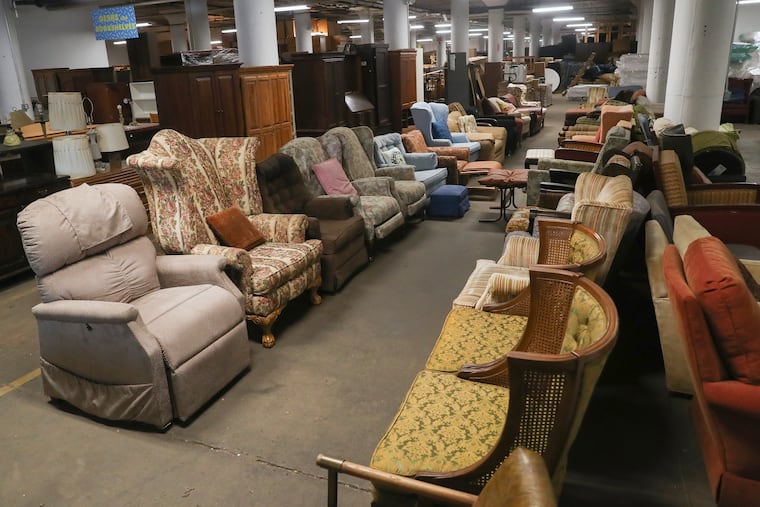 Furniture on display at the Philadelphia Furniture Bank in North Philadelphia in 2022. The Philadelphia Furniture Bank collects donated furniture and gives it for free to those who need it through the city's homeless services programs.