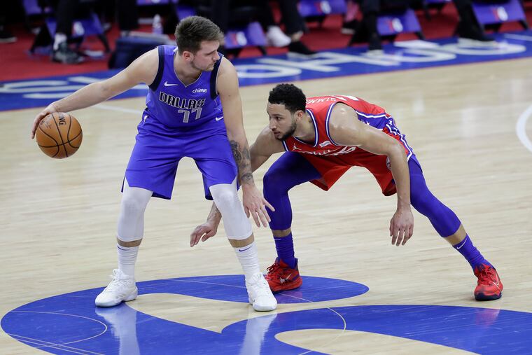 Sixers guard Ben Simmons defends Dallas Mavericks guard Luka Doncic in Thursday's 111-97 victory.