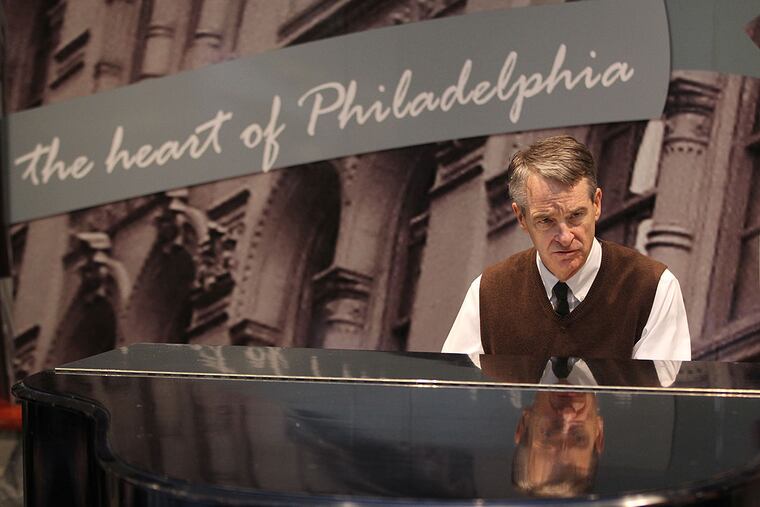 Mark Randall plays piano in the atrium of the Mellon Independence Center, the old Lit Bros. building, at lunchtime four days a week. He sometimes gets a bit of help from a group of dedicated regulars.