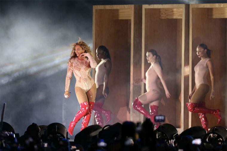 A crowd of about 70,000 was on hand as Beyoncé (left) closed out day one of the festival on Saturday. (DAVID MAIALETTI / Inquirer Staff Photographer)