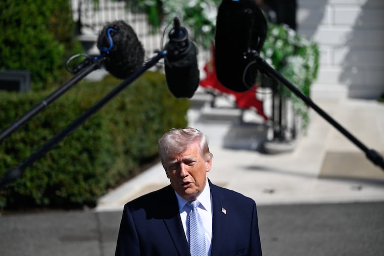 President Donald Trump meets with reporters outside the White House Thursday.