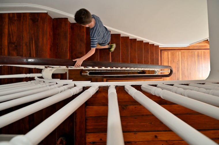 Saylor and Giordano's son walks up the spiraling steps in the center of the house to the bedrooms on the third floor.