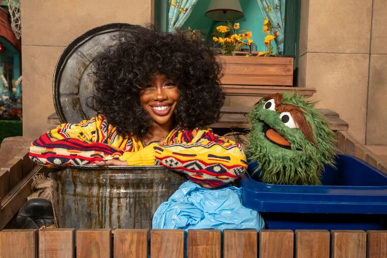 The singer SZA on the set of "Sesame Street" with the Muppet character Oscar the Grouch. The program is perhaps the clearest example of what public media can achieve, Amy Jordan writes.