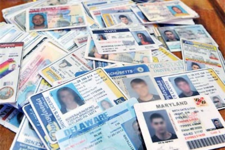 Confiscated fake I.D.'s on the bar at Keenan's Irish Pub in North Wildwood. (Gregg Kohl / For the Daily News)