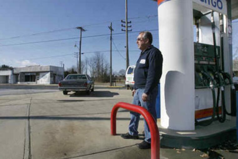 Wrightstown Mayor Tom Harper , at his pump, has seen 32 years of change.(Charles Fox/ Staff Photographer)
