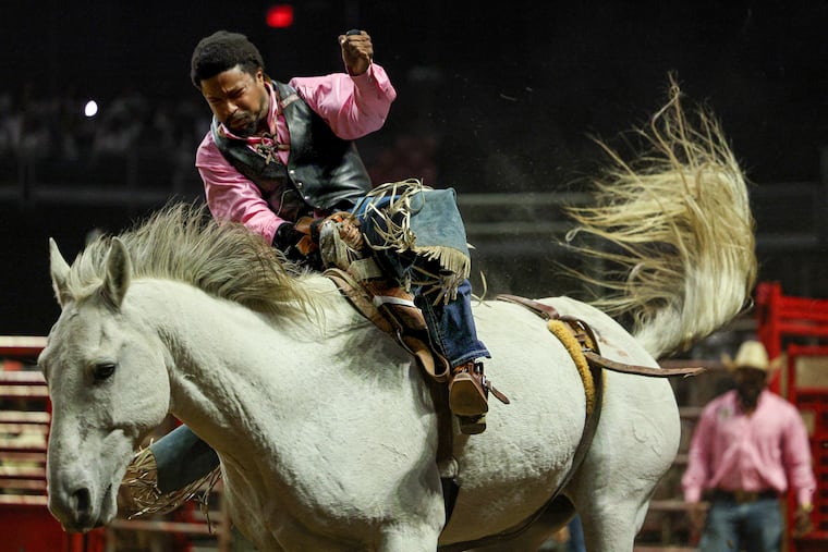 Bareback rider Patrick Liddell hangs on during the event at the 8 Seconds Rodeo in the Liacouras Center in Philadelphia on Saturday, Oct. 11, 2025.