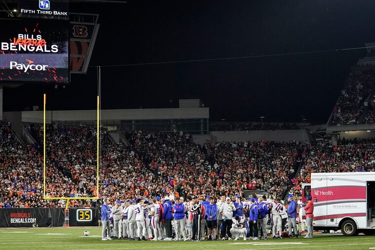The Buffalo Bills players pray for teammate Damar Hamlin during the first half against the Cincinnati Bengals on Monday.