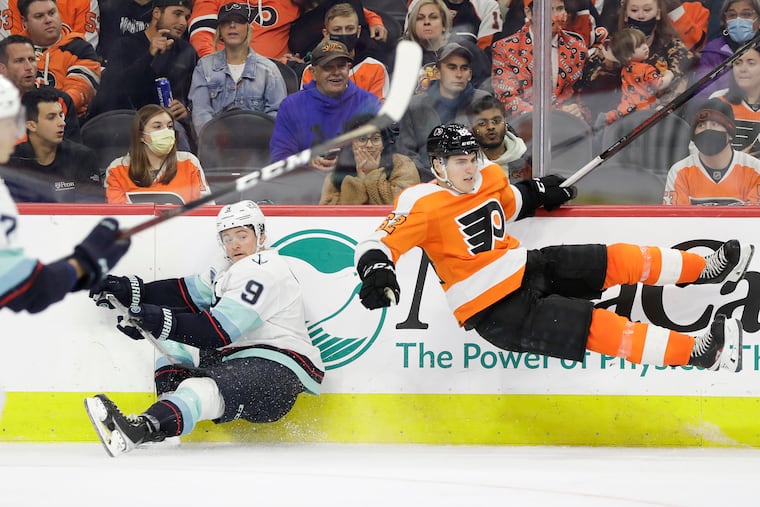Flyers' right wing Nicolas Aube-Kubel gets up-ended after checking Seattle's Kraken center Ryan Donato during the third period on Monday.