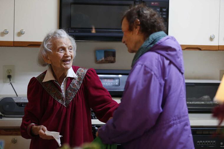 Loretta Katz, 85, (right) of Northeast Philadelphia, talks with Elizabeth Bleiman, 94, as she delivers Meals on Wheels to her in Northeast Philadelphia.